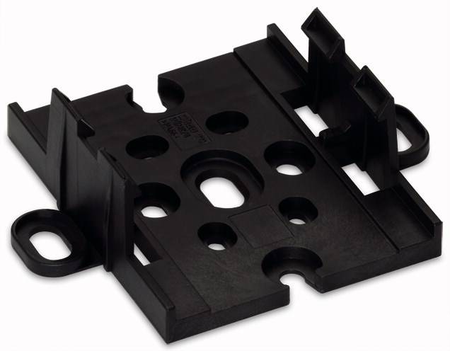 Componente in plastica nera con diverse aperture circolari e supporti a sinistra e a destra. Probabilmente utilizzato come elemento di fissaggio.
