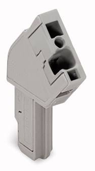 Un inserto grigio in plastica con diversi fori rettangolari e circolari, probabilmente parte di un dispositivo tecnico o di un raccordo.