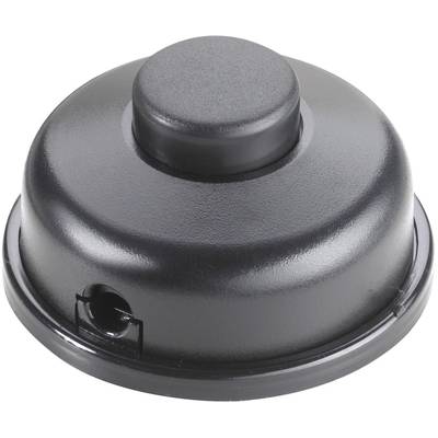 Un coperchio nero, rotondo, con un dischetto più piccolo e rialzato al centro e un'apertura sul lato.