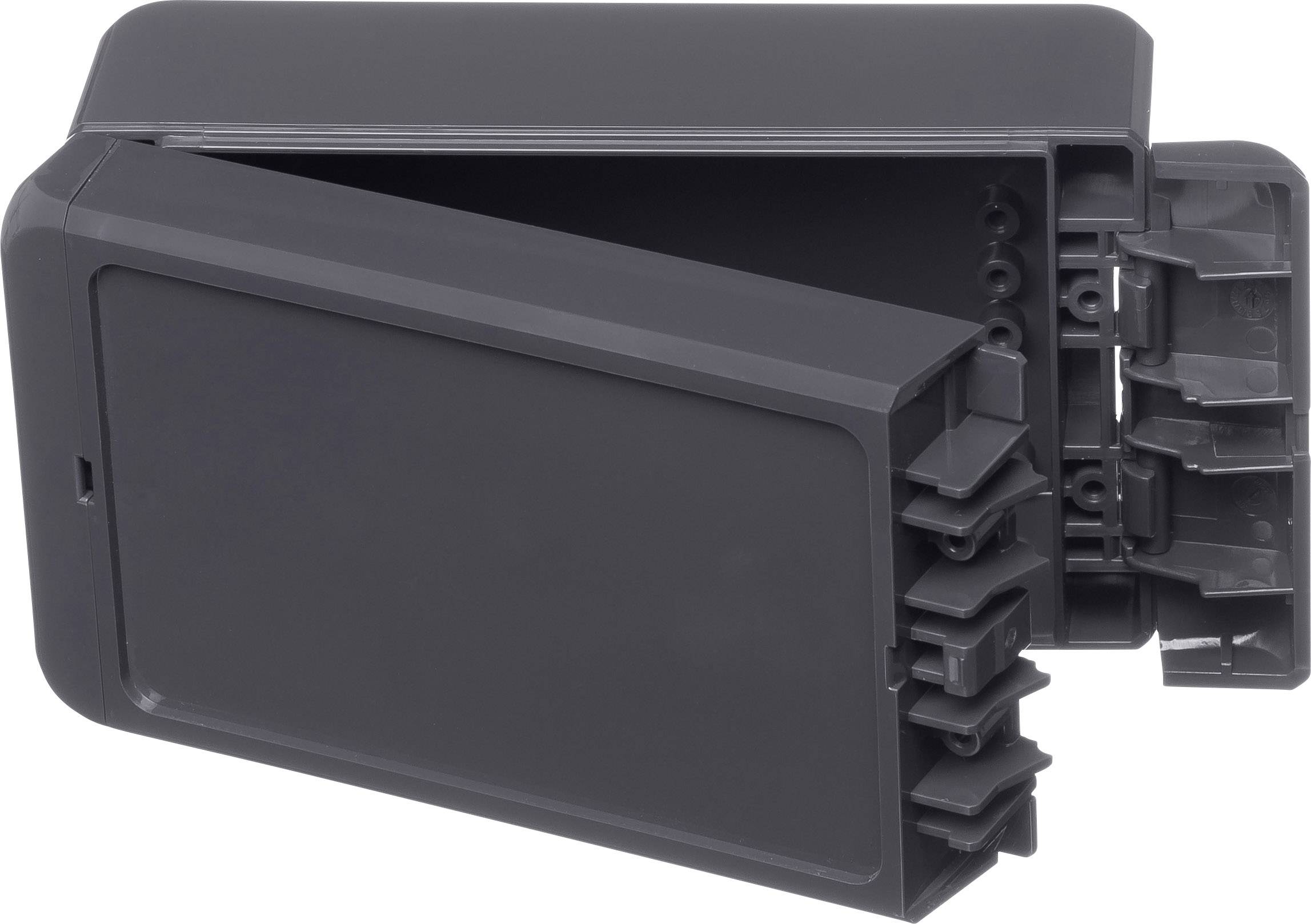 Un involucro rettangolare in plastica grigio scuro con un coperchio rimovibile, probabilmente utilizzato per componenti elettronici.