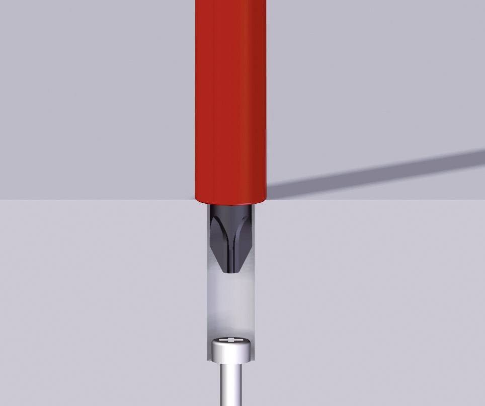 Una trapano rosso, posizionato verticalmente sopra una piastra metallica, con una punta inserita che sta trapanando un pezzo di metallo.