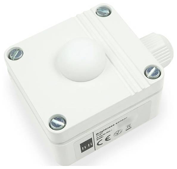 Een witte bewegingsdetector is gemonteerd in een rechthoekige behuizing met vier schroeven in de hoeken.