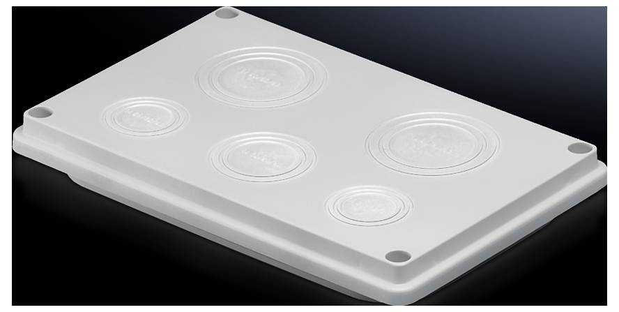 Een witte deksel met vier ronde verhogingen rust op een donker oppervlak.