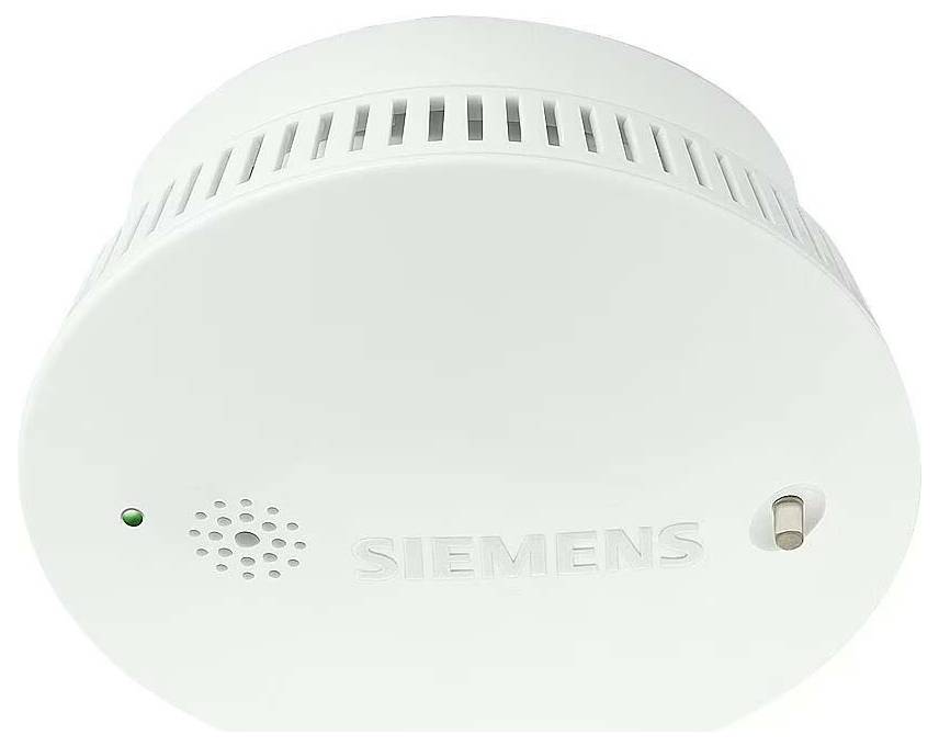 Een witte rookmelder van het merk 'Siemens', toont een ventilatierooster en een controlelampje.
