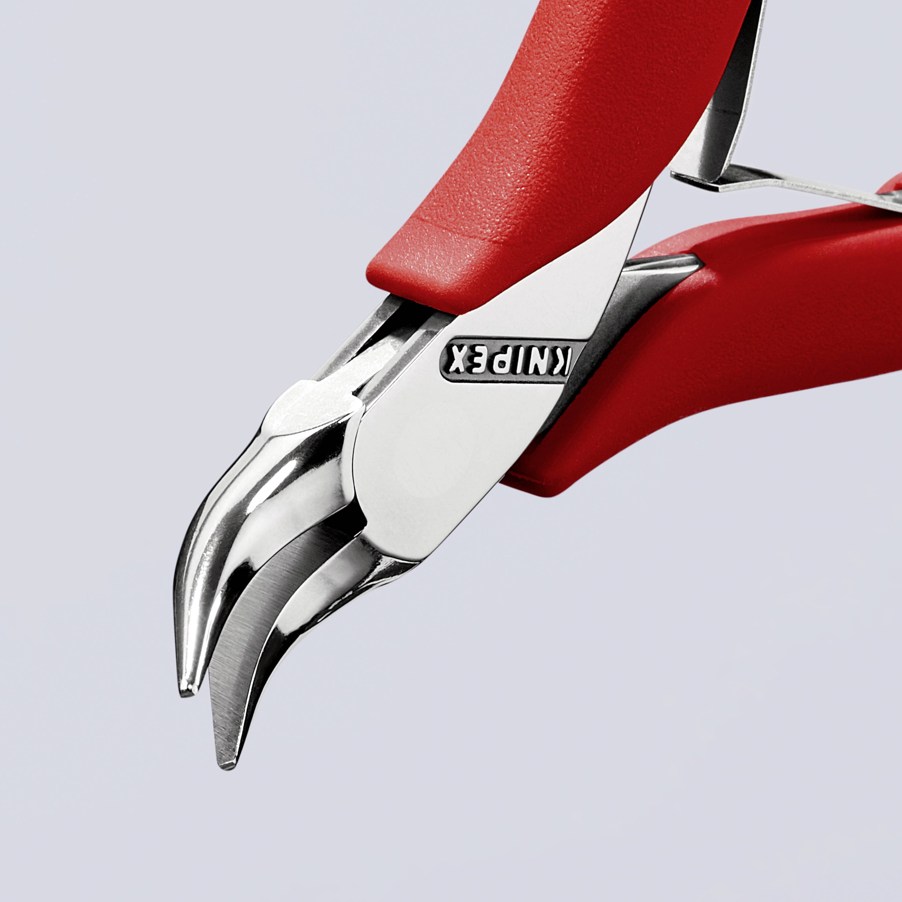 Rode Knipex-tang met gebogen messen, close-up van gereedschap voor precisieknipwerk en handmatige werkzaamheden.
