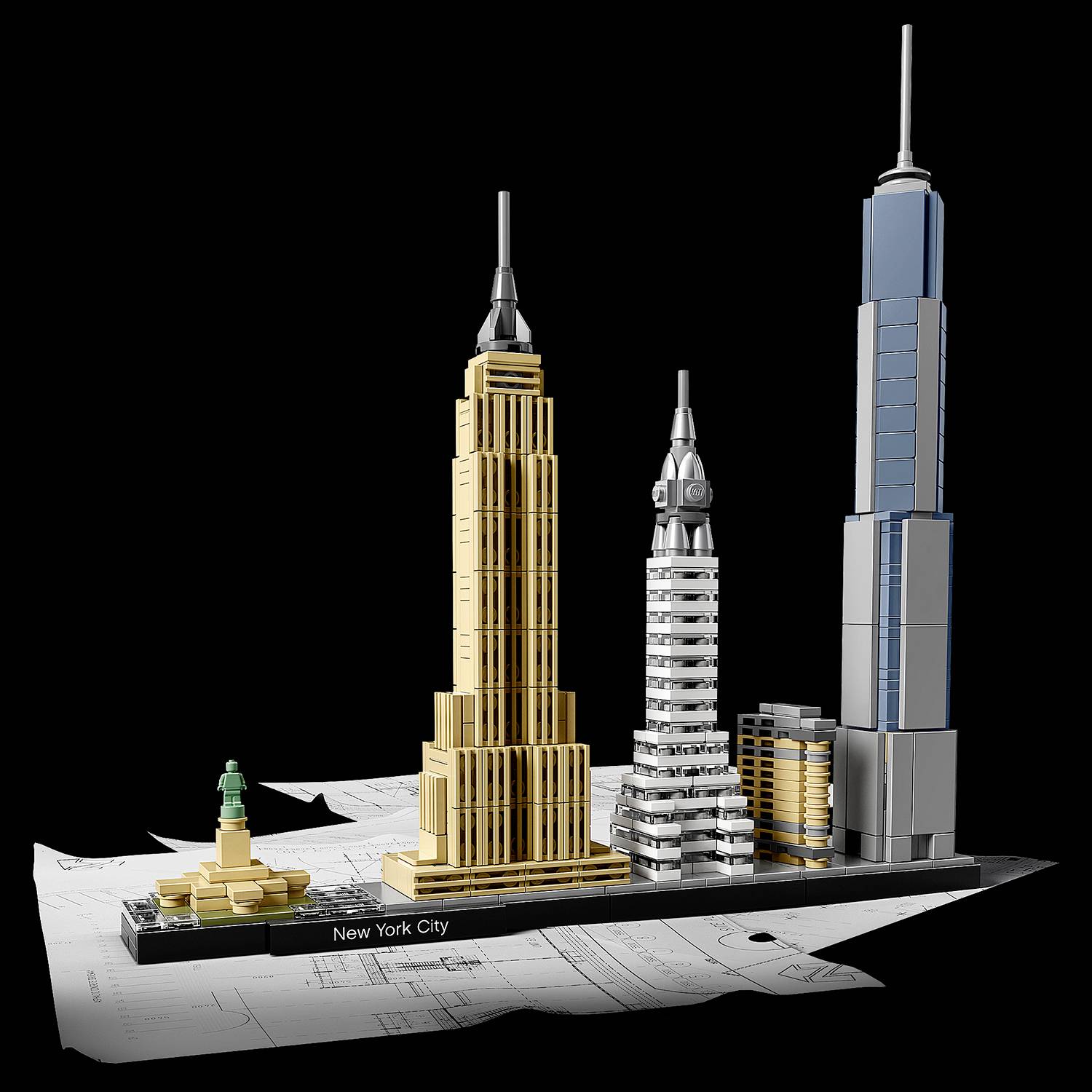 Bouwsteenmodel van New York City met het Vrijheidsbeeld en imposante wolkenkrabbers, geplaatst op een stadsplattegrond.