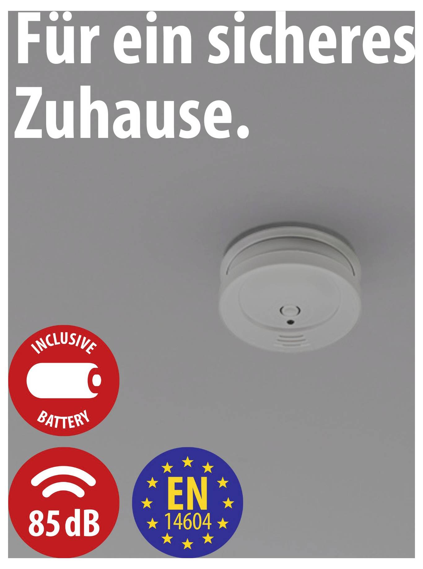 Reclamefoto van een rookmelder aan het plafond met de tekst 'Voor een veilig thuis.', aangevuld met symbolen voor inclusief batterij, 85 dB en EN 14604.