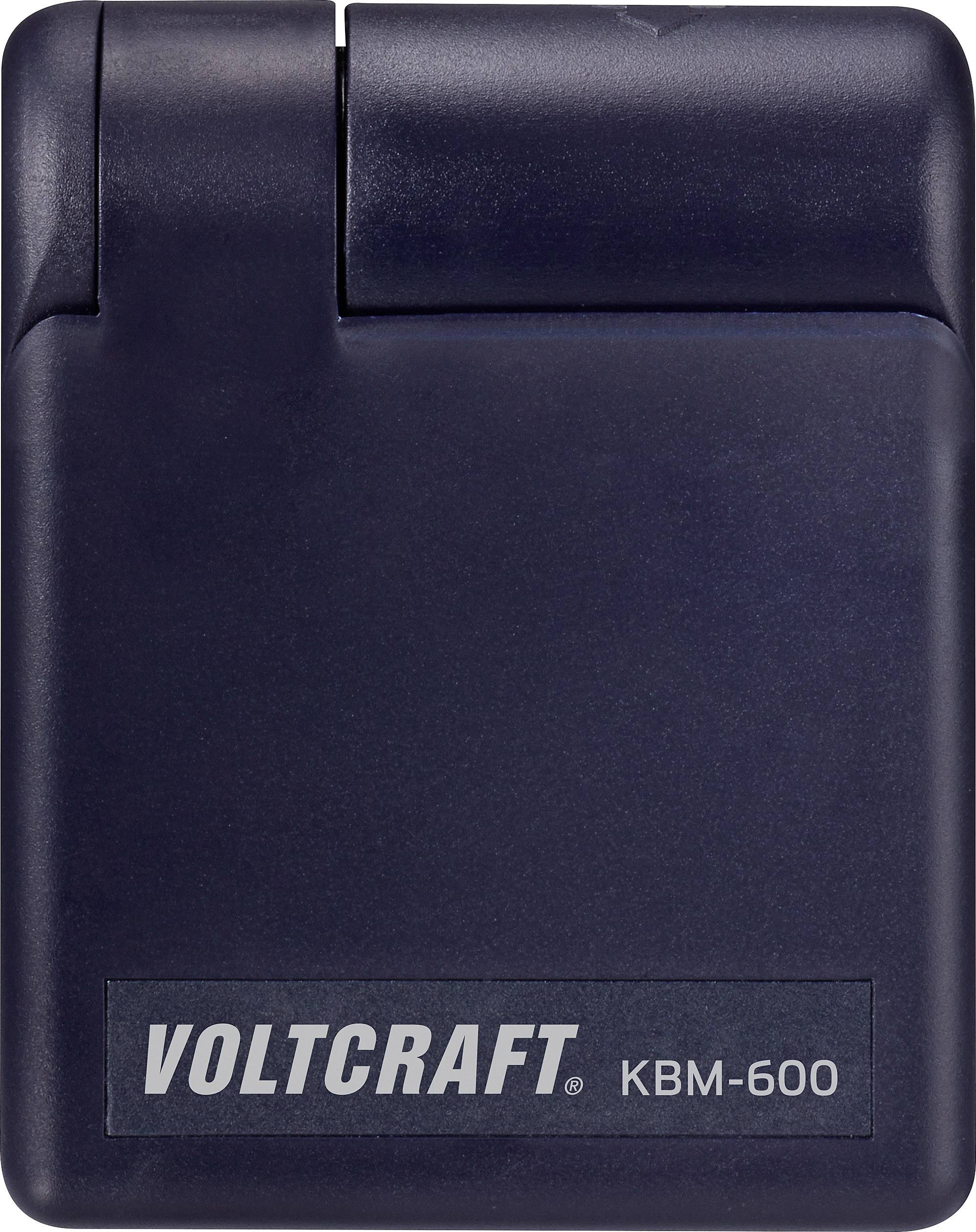 Compacte adapter van Voltcraft, model KBM-600, in donkere kleur. Gebruikt voor speciale elektronische toepassingen en metingen.