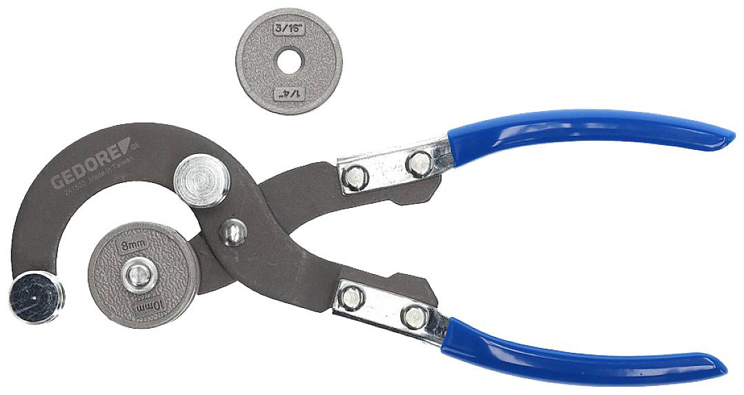 Tegelperforator met blauwe handgrepen, verwijdert cirkelvormige secties uit tegels. Twee verwisselbare snijwielen voor verschillende diameters.