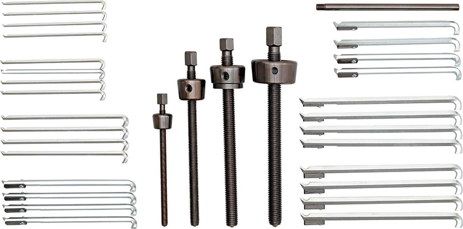 Verschillende trekker-sets: Drie schroeftrekkers in het midden, omringd door meerdere haken van verschillende formaten voor mechanische werkzaamheden.