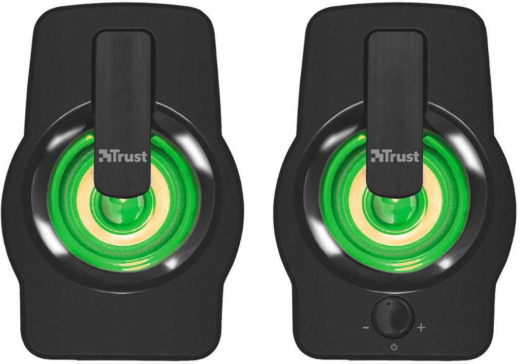 Twee zwarte luidsprekers met groen oplichtende elementen, een plus- en mintoets op een van de speakers, merknaam 'Trust' zichtbaar.