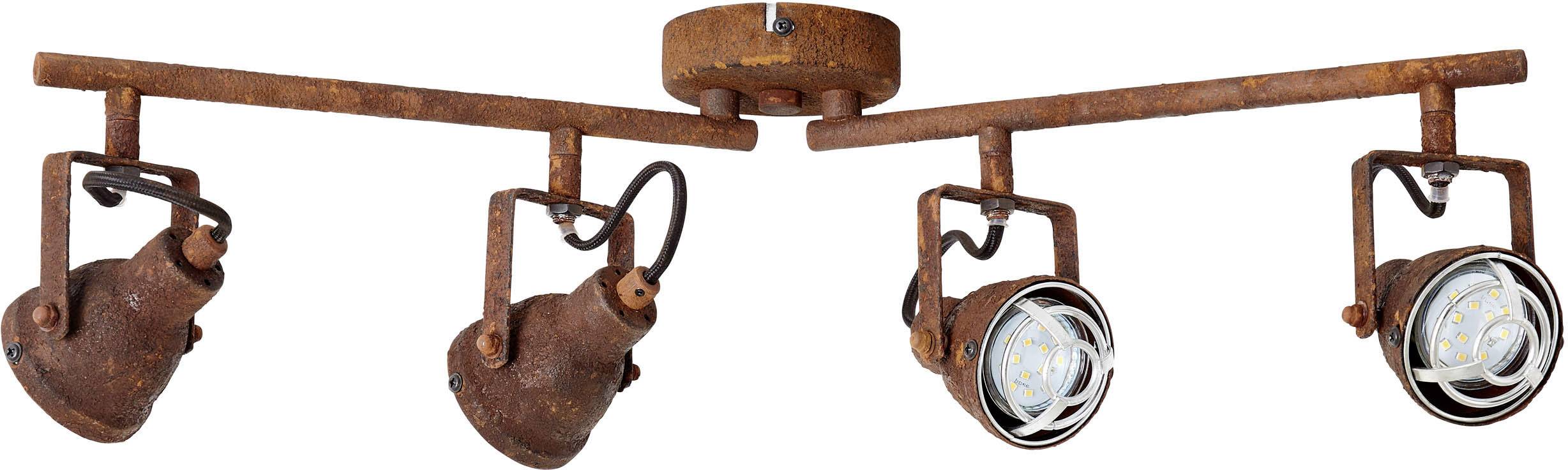Een plafondlamp van roestkleurig metaal met vier draaibare lampen, die een industriële stijl en warm licht bieden voor woonruimtes.
