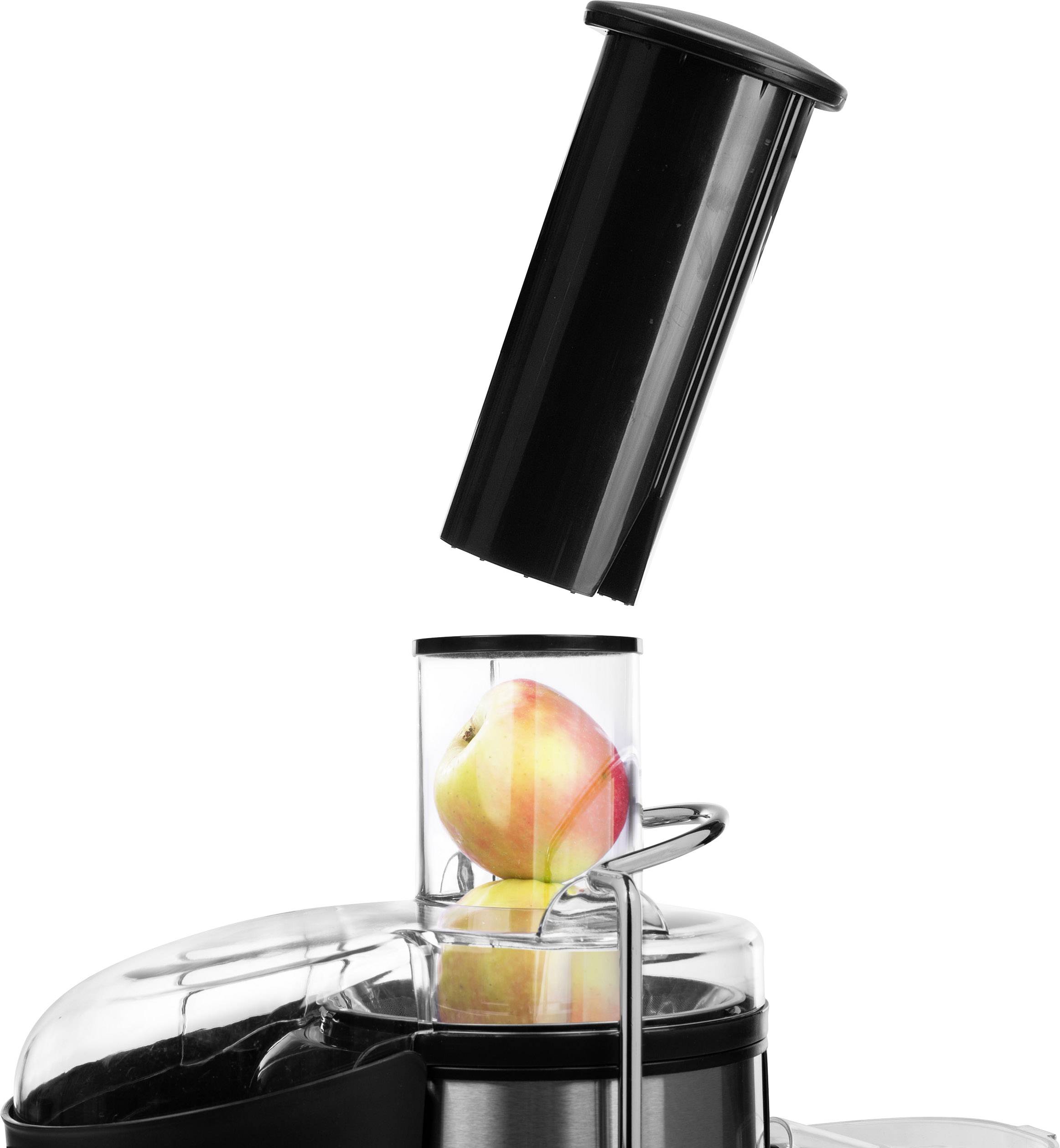 Een sapcentrifuge met een appel in de invoerbuis. Een zwarte deksel is geopend om de appel in te voeren.