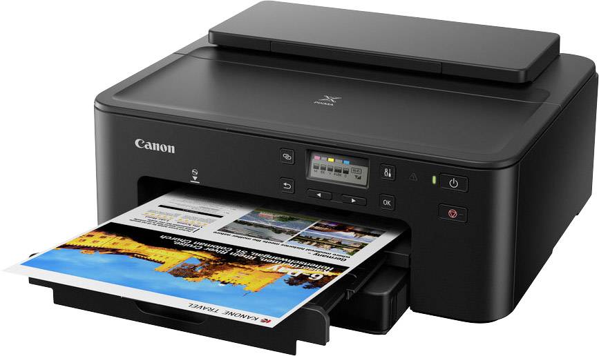 Een zwarte Canon-printer drukt een kleurenfoto af, zichtbaar in de papierlade. De printer heeft bedieningsknoppen en een display.