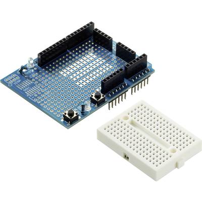 Een groen Arduino-shield met verschillende aansluitingen en pinnen naast een wit breadboard, gebruikt voor elektronicaprojecten.
