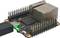 Een enkelplaats-computer met USB-C-aansluiting en een oplichtende LED. Zichtbaar zijn de Rockchip-processor en Ethernet-poort.