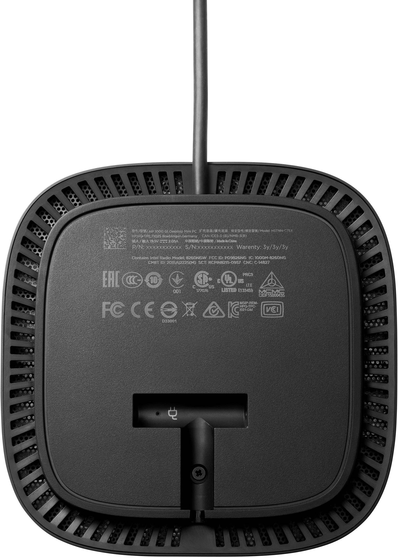 Onderkant van een elektrisch apparaat met kabel. Toont verschillende certificerings- en veiligheidssymbolen zoals CE, FCC en andere.