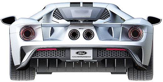 Een zilveren sportwagen van achteren, met twee grote uitlaatpijpen, opvallende achterlichten en een Ford-logo.