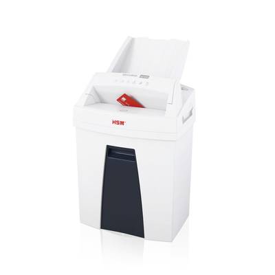 Een witte papierversnipperaar versnippert een rood vel papier.