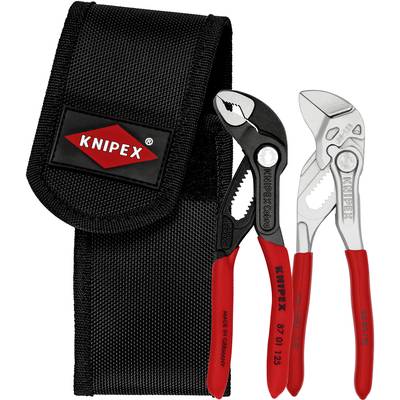 Twee tangen met rode handgrepen voor een zwart etui met de opdruk 'Knipex', één zwart en de andere zilverkleurig, naast elkaar liggend.