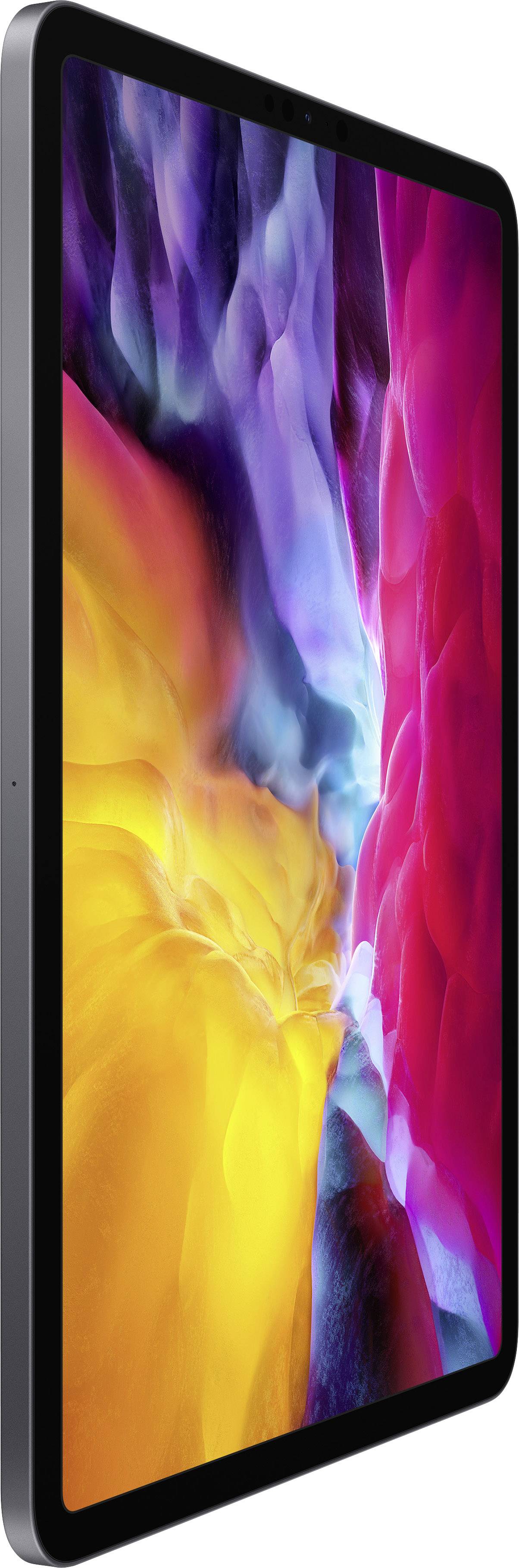 Een tablet met een kleurrijk scherm toont levendige kleurengolven in geel, blauw en rood.