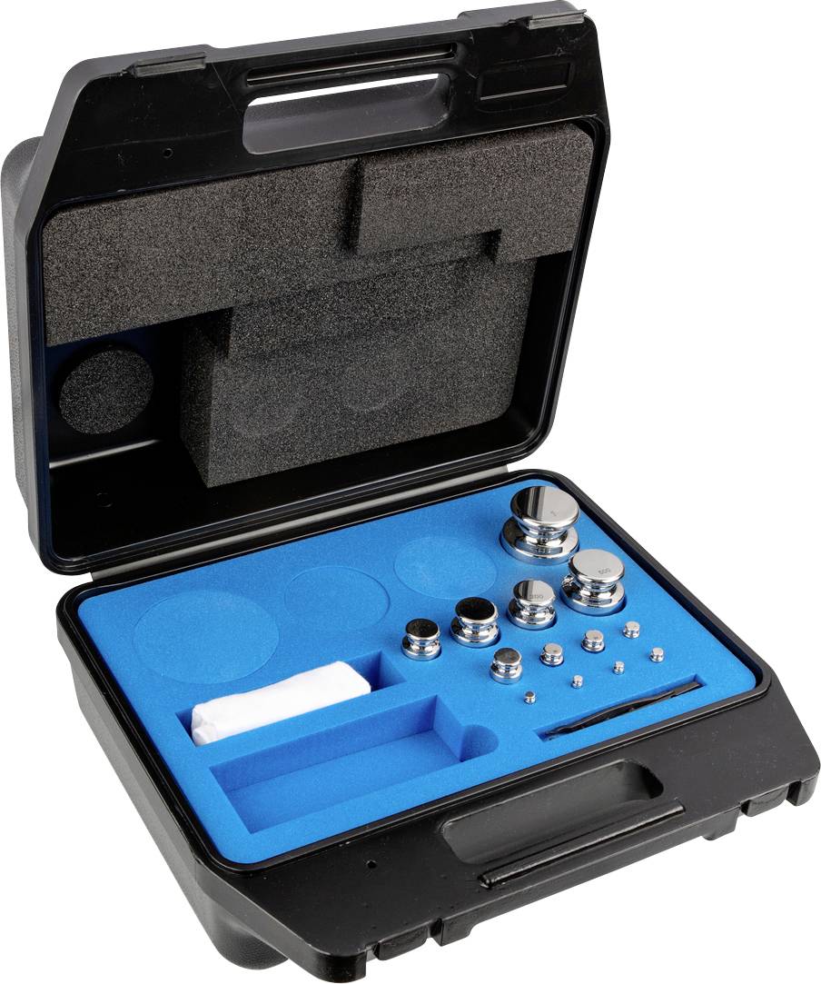Open zwarte koffer met blauw schuimrubber aan de binnenkant, bevat verschillende metalen gewichten van verschillende groottes en vormen.
