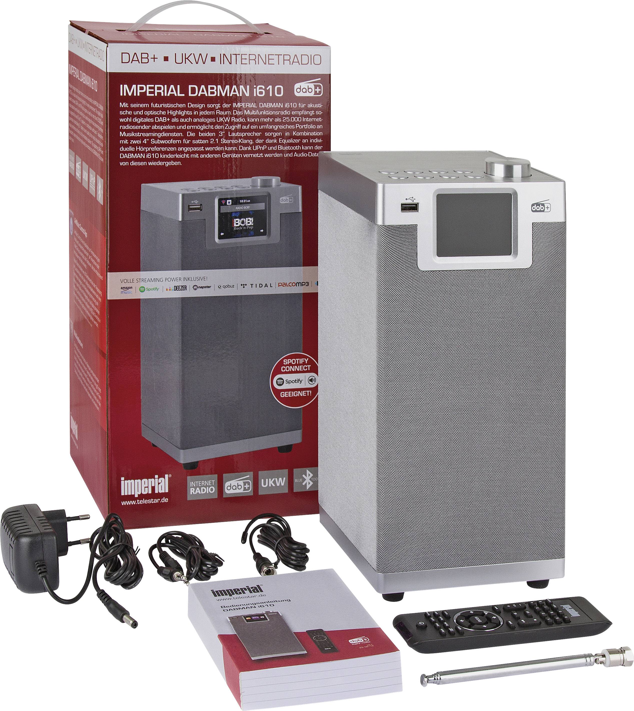 'Imperial Dabman i610' Radio naast geopende verpakking. Bevat afstandsbediening, antenne, voedingsadapter en handleidingen.