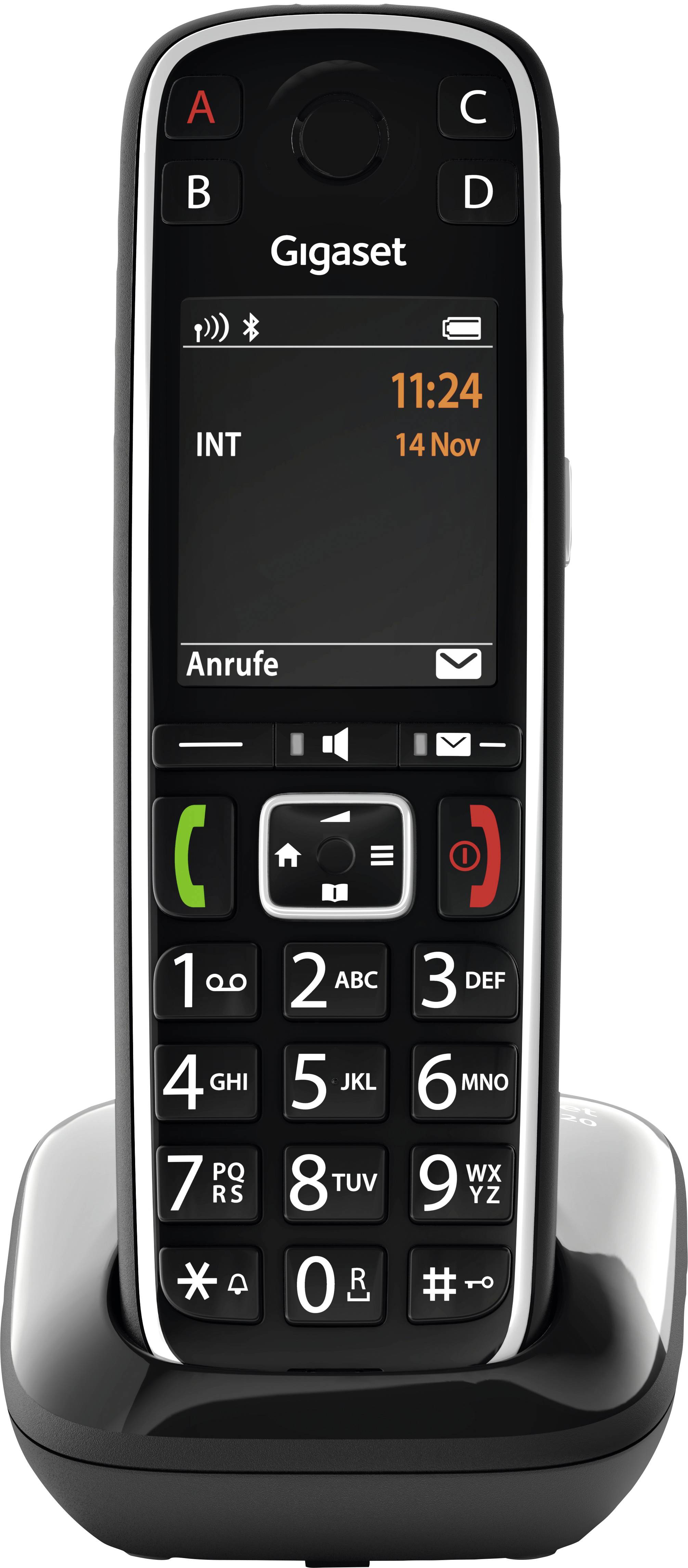 Draadloze telefoon met groot display op laadstation. Het display toont de tijd 11:24 en de datum 14 november. Toetsen voor nummers en functies eronder.