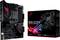 Moederbord ASUS ROG STRIX B550-F Gaming (Wi-Fi) naast de verpakking. Zwart design met rode accenten en een verlicht logo.