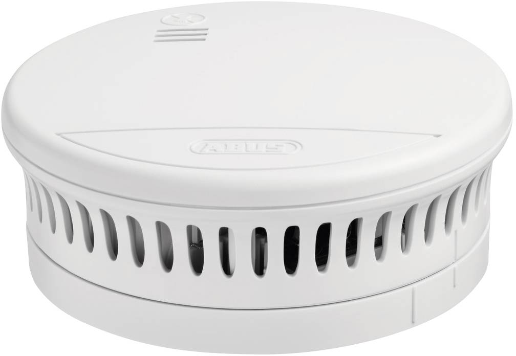 Een witte rookmelder in ronde vorm met ventilatiesleuven aan de zijkant.