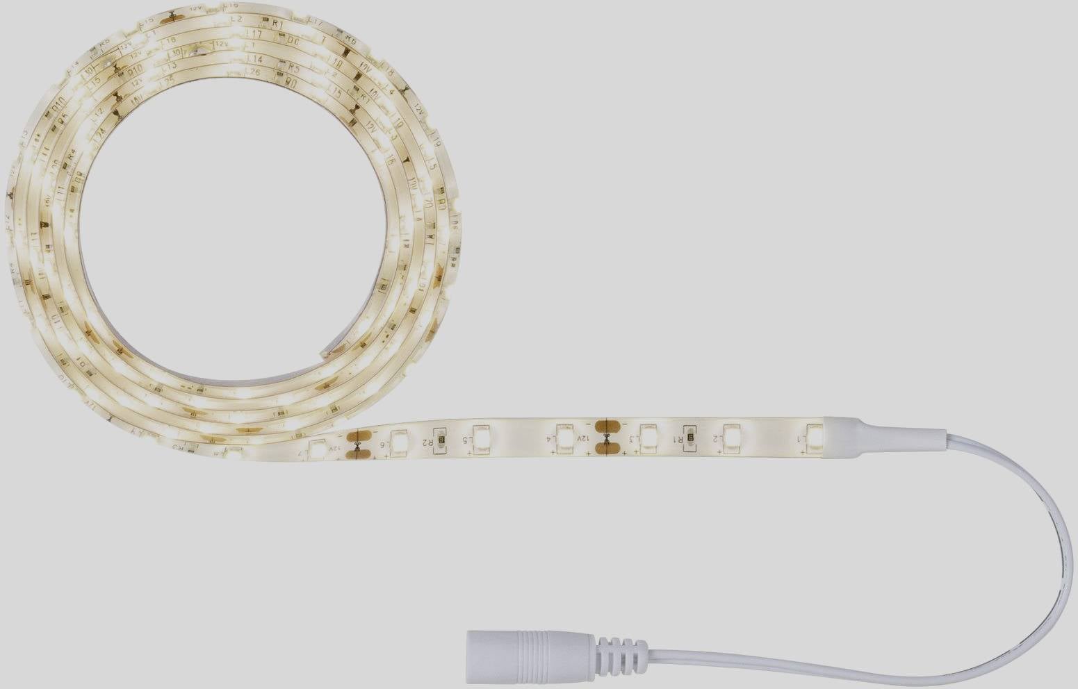 Een opgerolde LED-lichtstrip die eindigt in een wit snoer. Ideaal voor decoratieve verlichting in binnenruimtes.