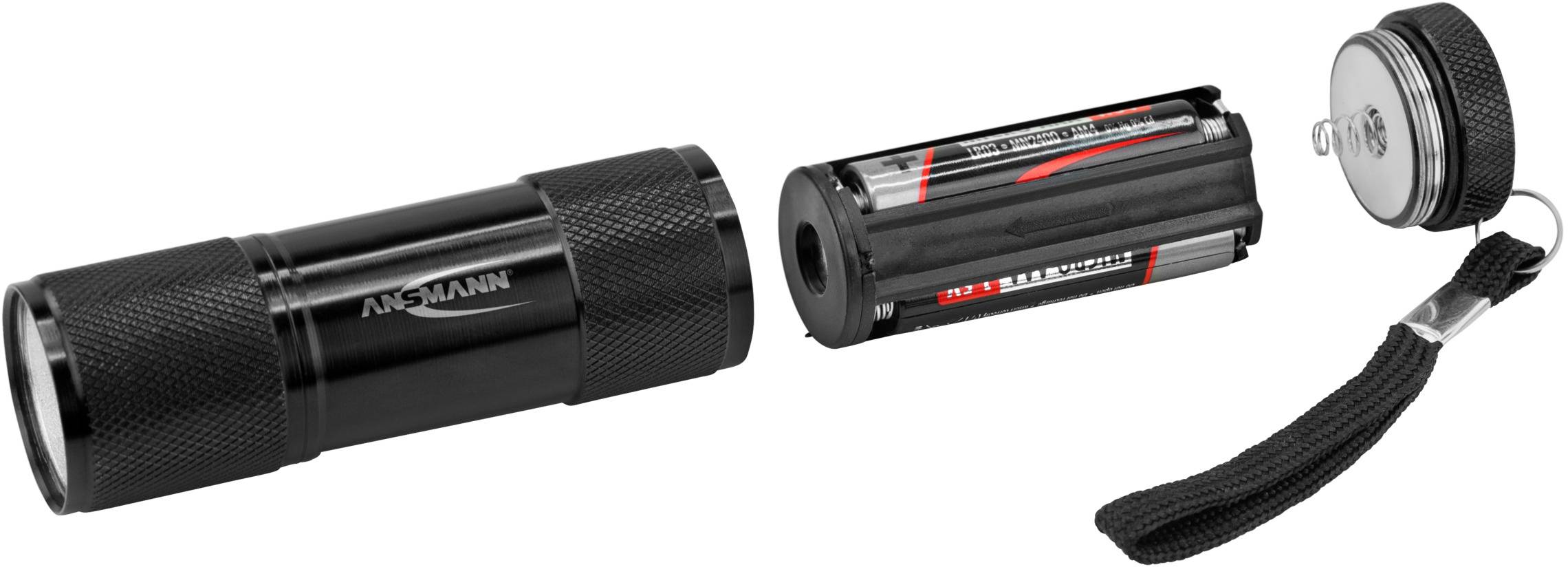 Gedemonteerde zaklamp met batterijvak en deksel, voorzien van handlus.