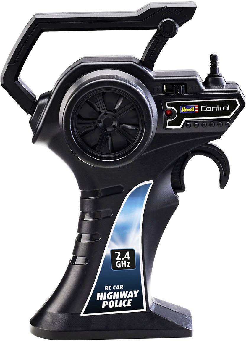 Zwarte RC-afstandsbediening met handgreep, antenne en opschrift 'RC Car Highway Police', frequentie 2.4 GHz, merk Revell Control.