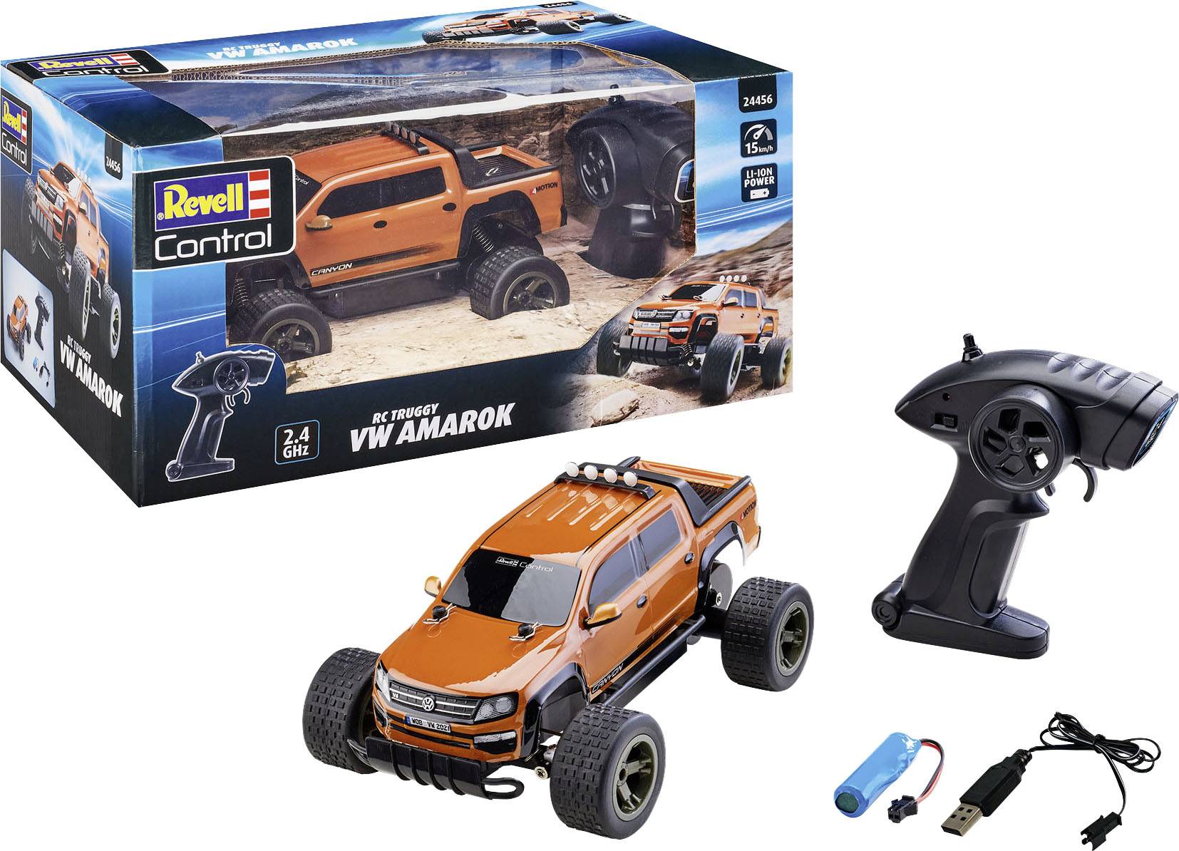 'Revell Control VW Amarok RC-Truck' in oranje, gepresenteerd op verpakking. Bevat afstandsbediening, oplader en batterij.