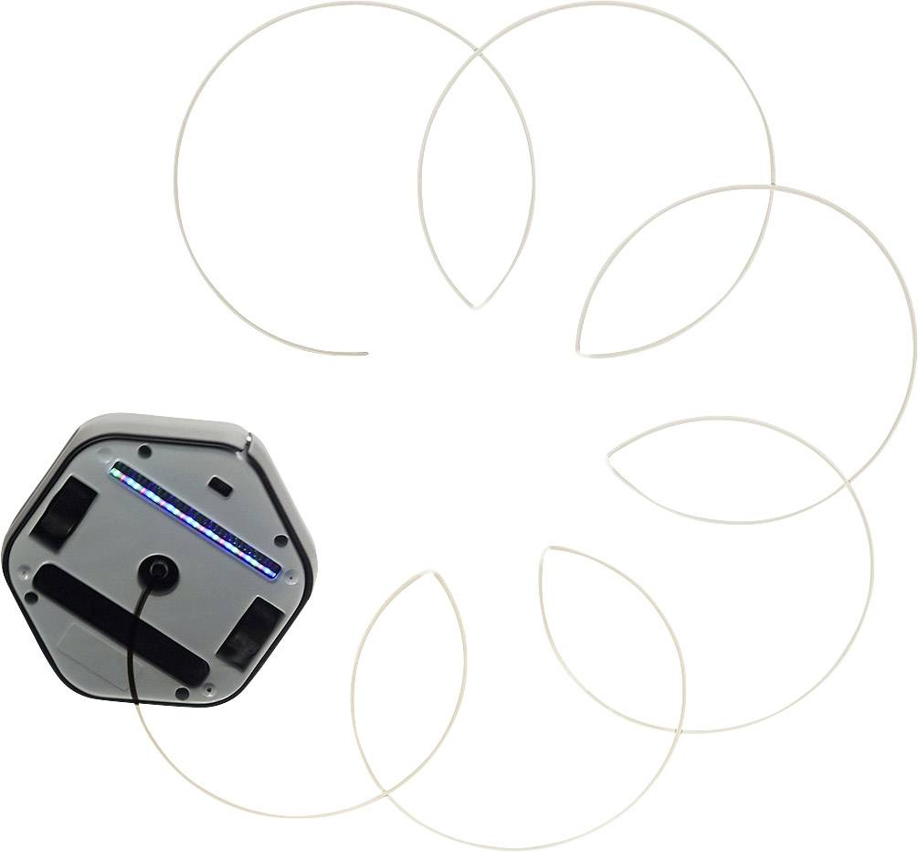 Een ronde robot creëert lichtgevende, overlappende cirkels op een oppervlak.