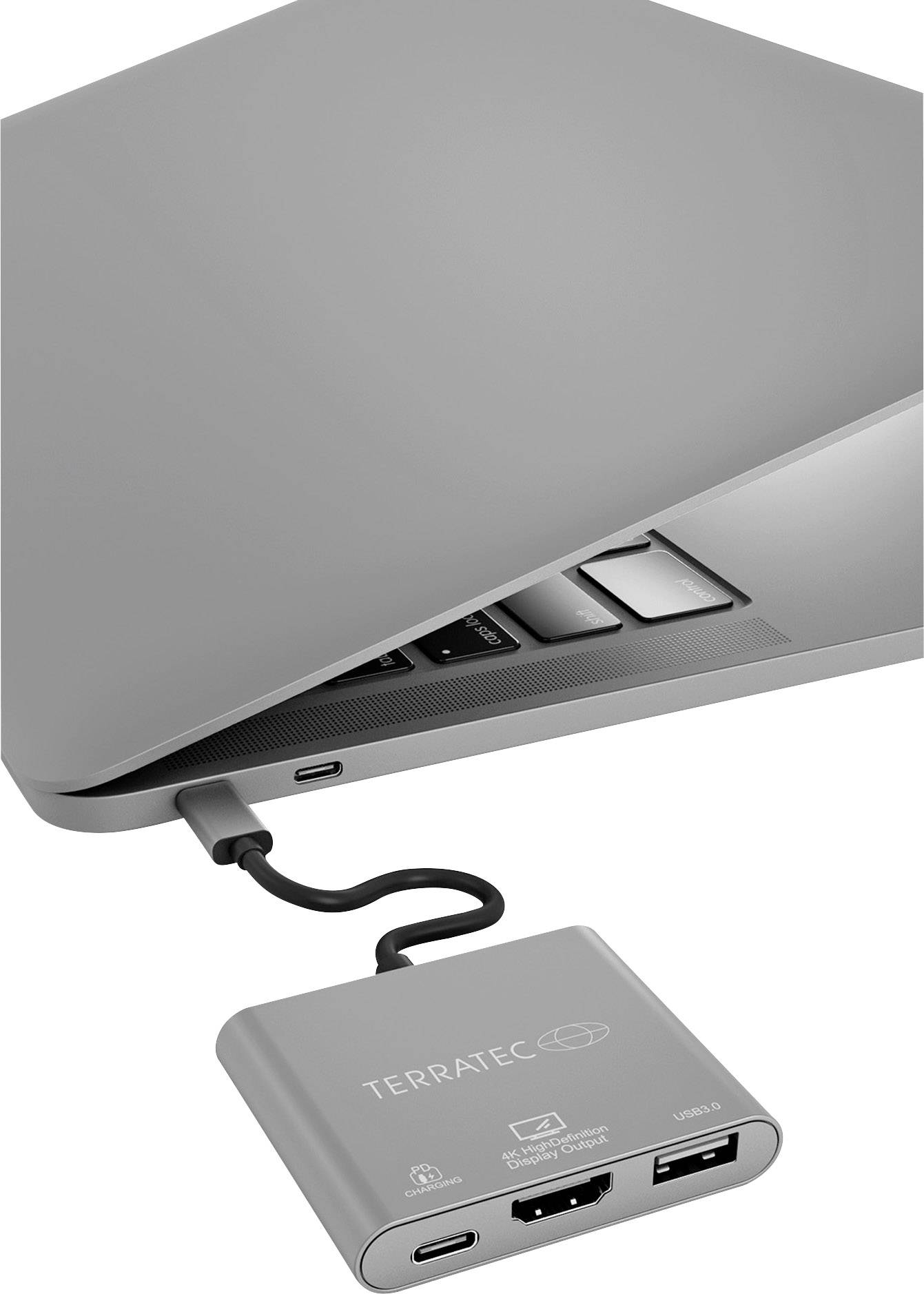 Laptop met een opengevouwen hoek, verbonden met een Terratec USB-C adapter. Adapter heeft HDMI, USB-C en USB-poorten.