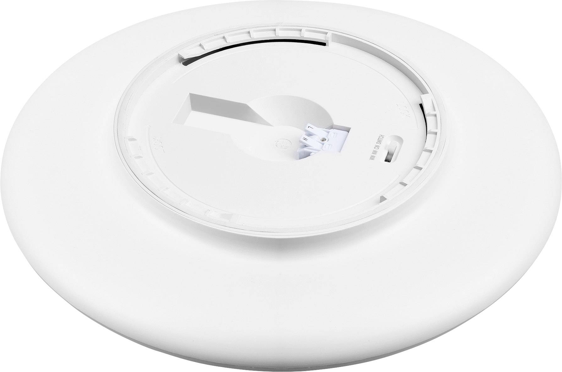 Een wit, rond muur- of plafondmontagedeel voor de bevestiging van een elektronisch apparaat. Het toont het interieur met een houder.