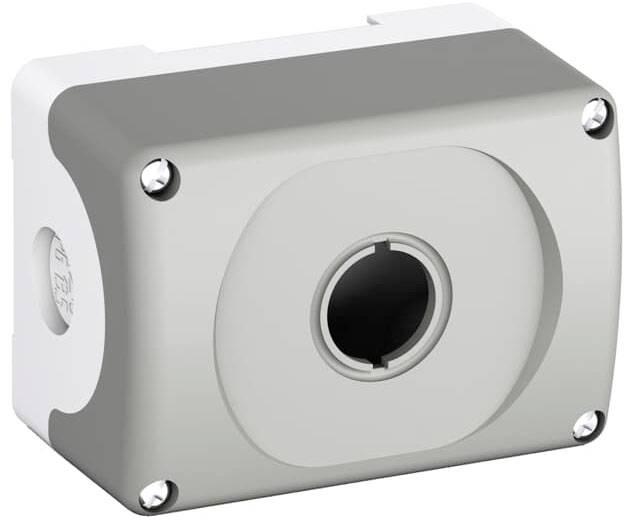 Grijs rechthoekig behuizing voor schakelaarmontage, met een centraal, rond uitsparing en vier schroeven in de hoeken.