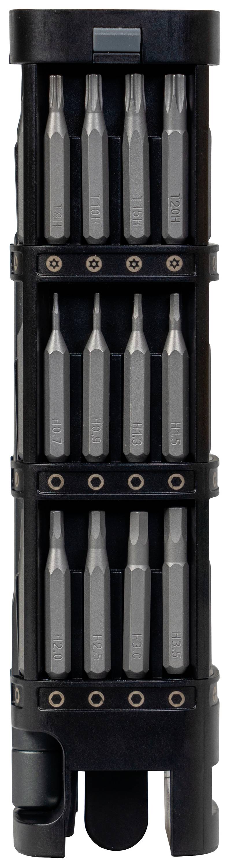 Een zwarte, cilindrische gereedschapshouder met drie rijen zilveren boren of beitels, symmetrisch gerangschikt.