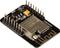 De afbeelding toont een ESP32-S microcontrollermodule met meerdere pinnen, een gele condensator en een zilverkleurige WiFi-chip.