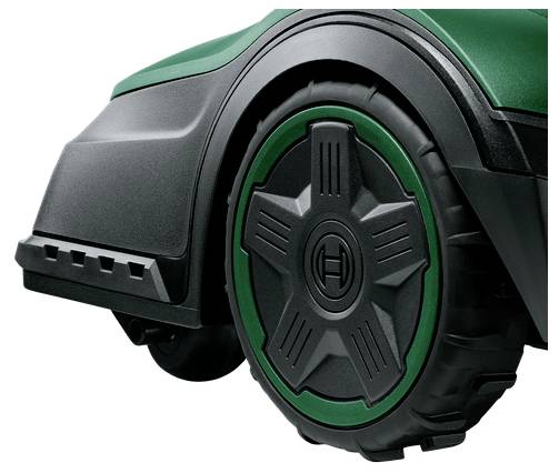 Een groen, modern grasmaaiervelg in close-up met een sterpatroon op de velg.