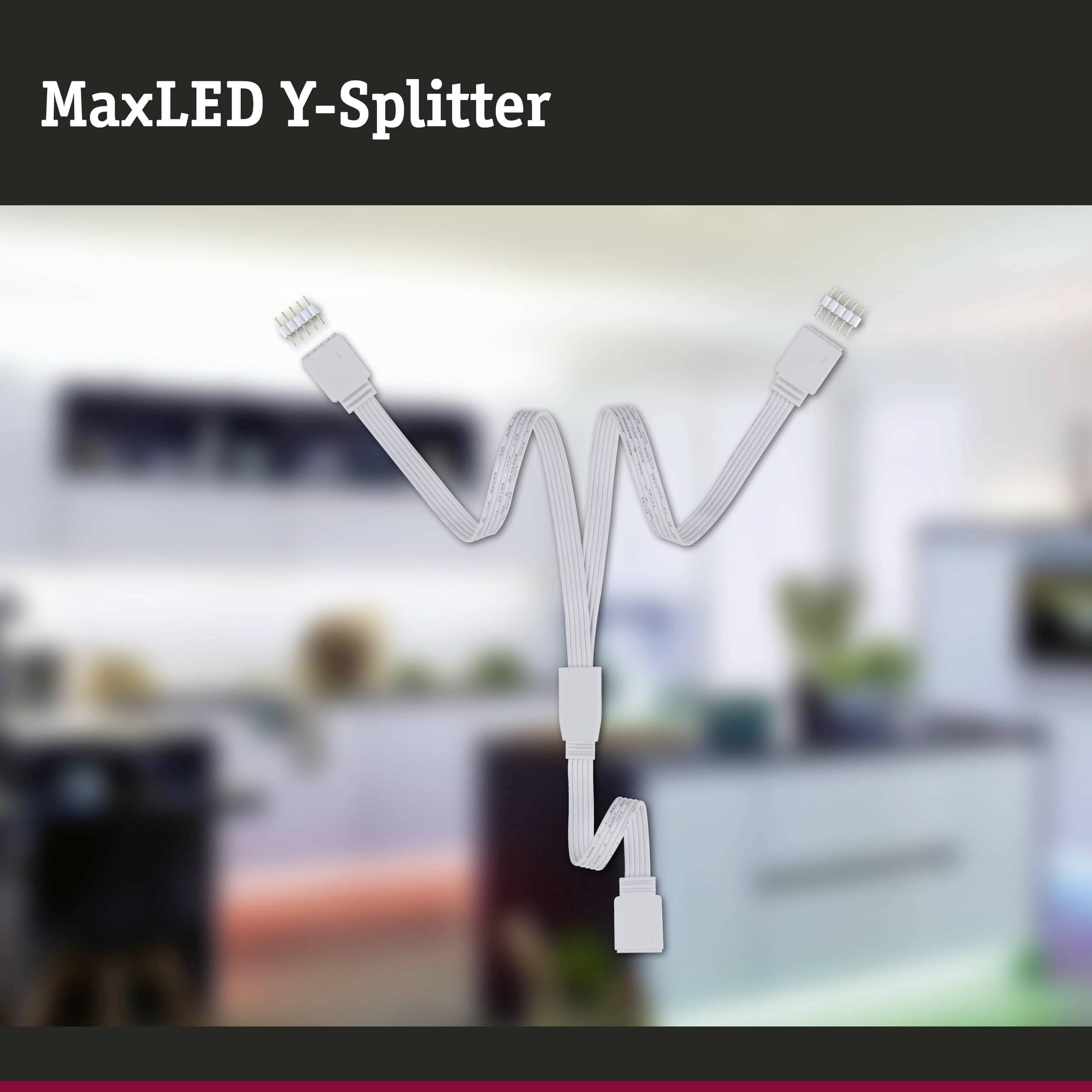 Tweearmige 'MaxLED Y-Splitter' voor het verdelen van LED-stroomverbindingen, weergegeven tegen een onscherpe ruimteachtergrond.