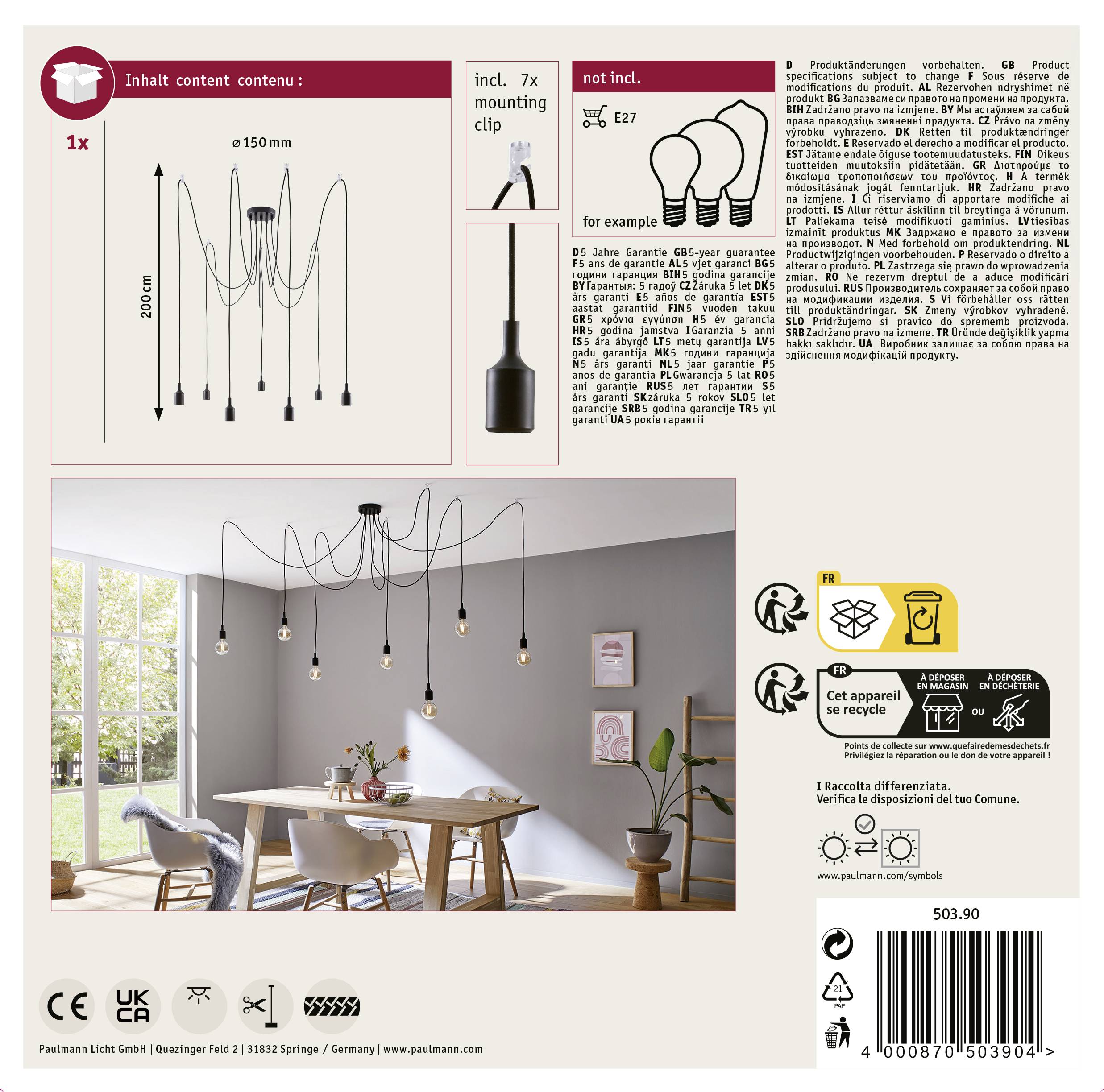 'Packaging of a black hanging light set with seven fixtures. Pictured in a living room with a dining table.'