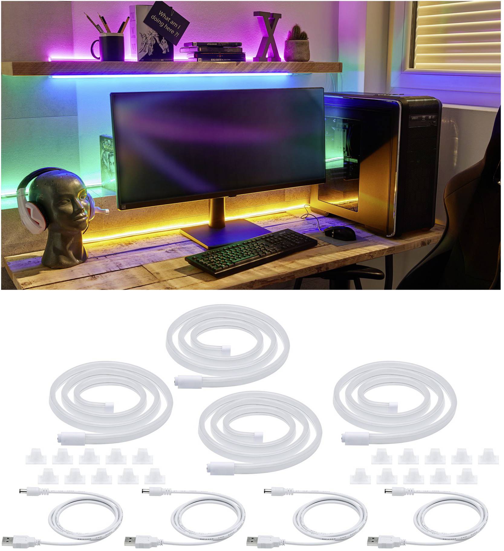 'Bureau met kleurrijke LED-verlichting, monitor, toetsenbord en koptelefoon. Daaronder vijf opgerolde kabels met toebehoren, klaar voor installatie.'