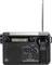 Een zwarte draagbare radio met antenne, LED-display toont '12:05', draaiknoppen voor volume en afstemming, merk 'Renkforce'.