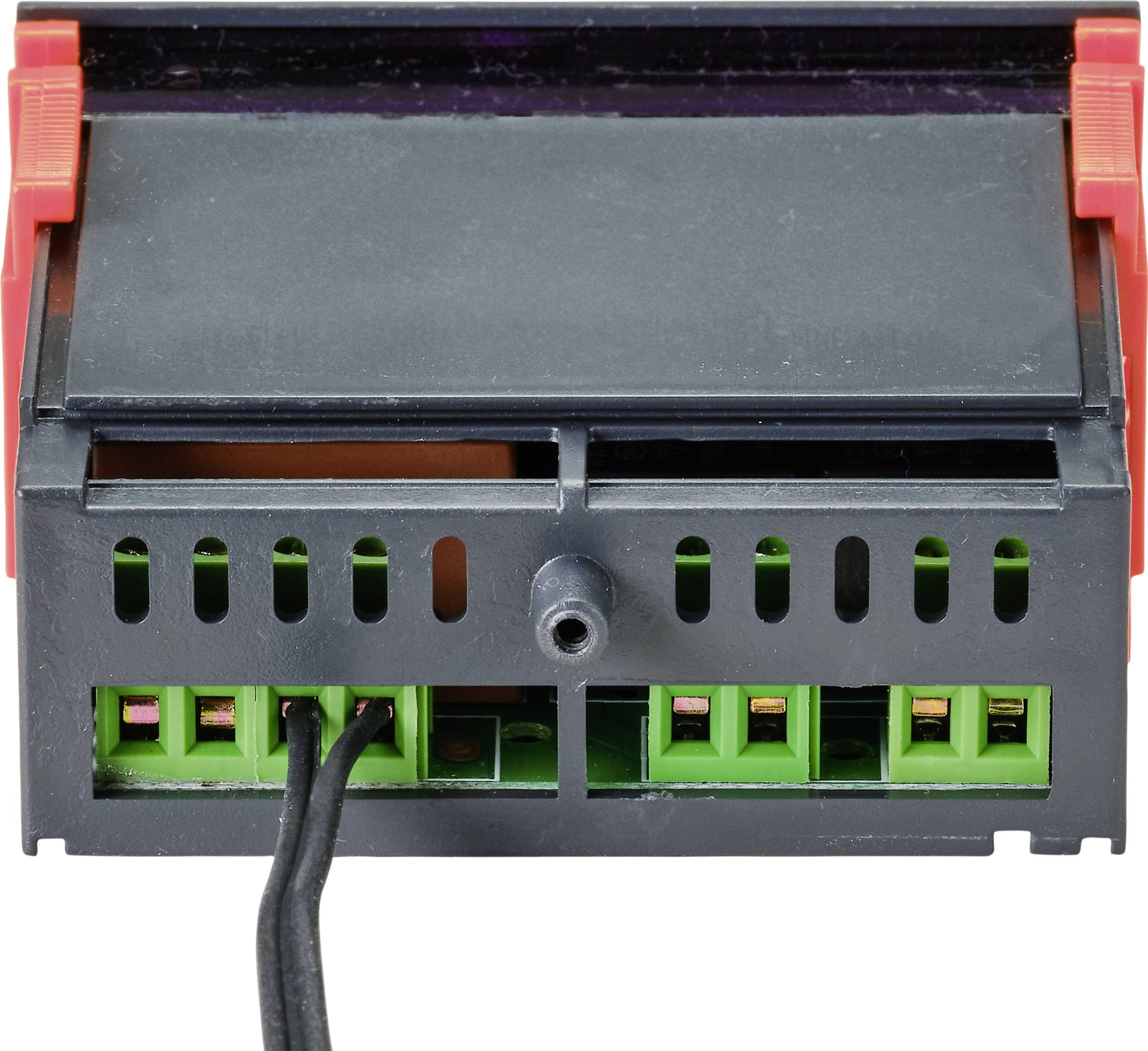 Een zwart elektrisch apparaat met een groen binnenwerk en rode zijkanten. Twee zwarte kabels zijn onderaan links aangesloten.