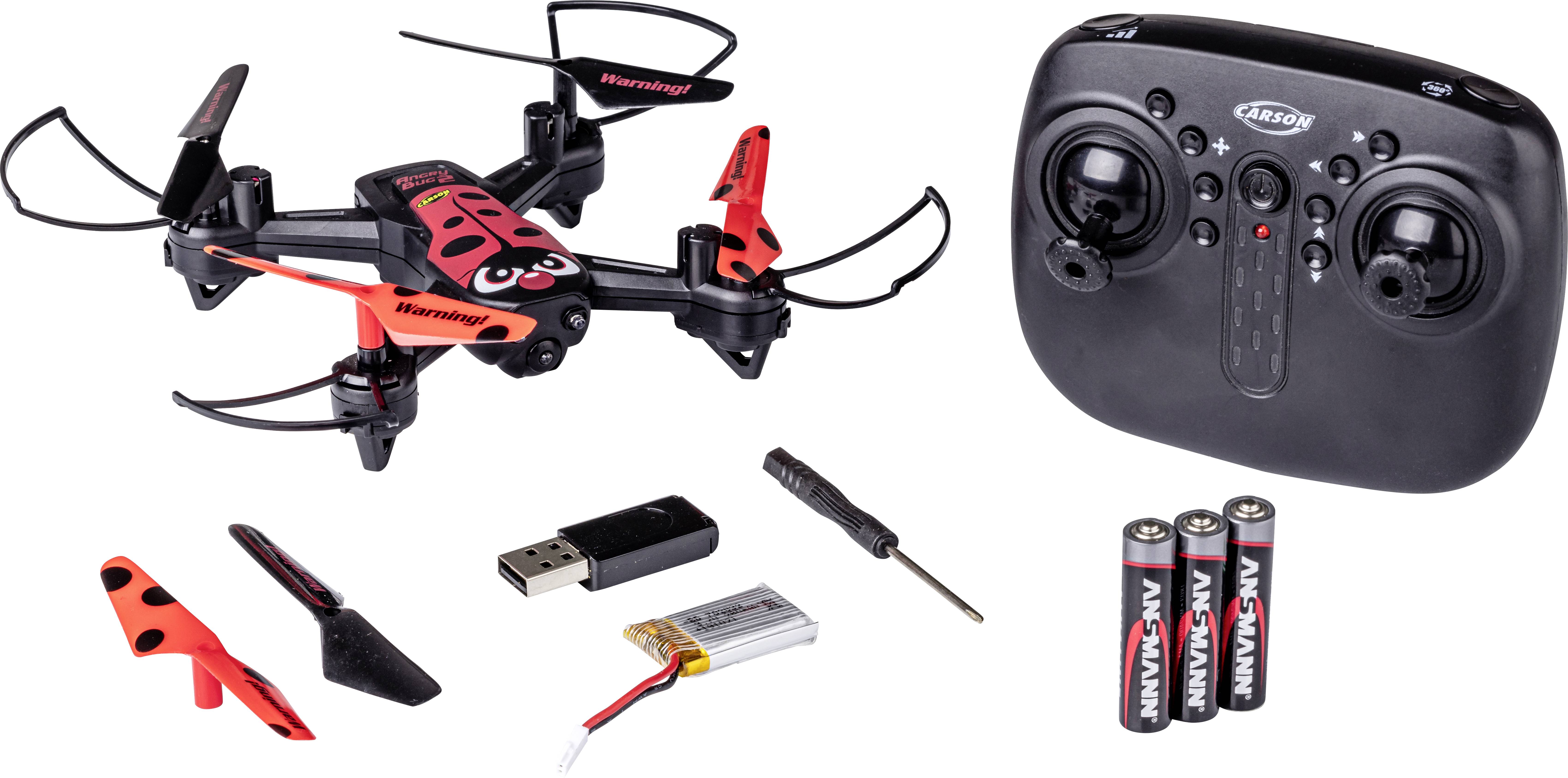 'Een rood-zwarte speelgoed-drone met afstandsbediening, USB-oplader, schroevendraaier, reservepropellers en batterijen.'