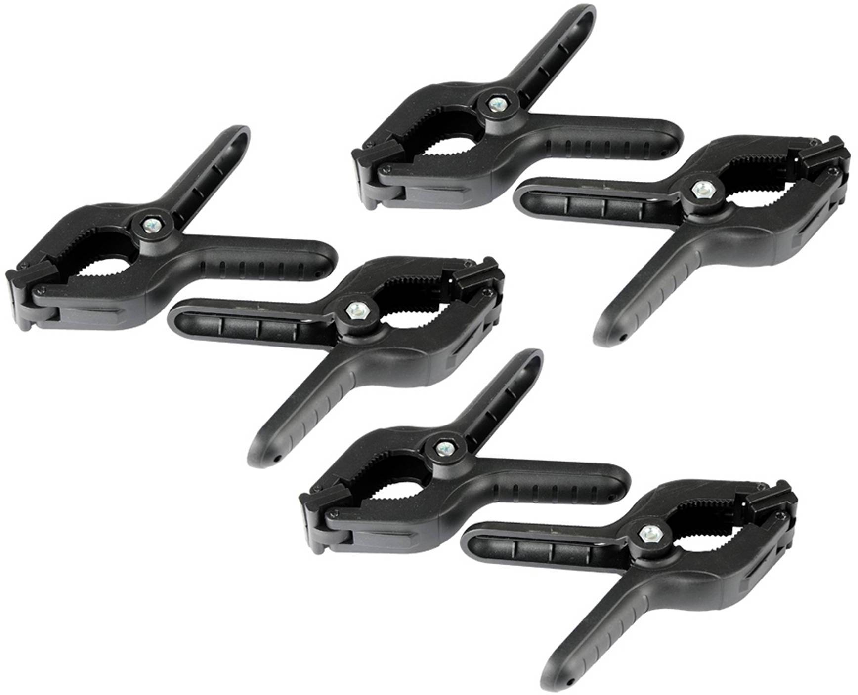 Vijf zwarte kunststof klemmen met getande grijpoppervlakken en metalen veren, gelijkmatig gerangschikt op een witte achtergrond.