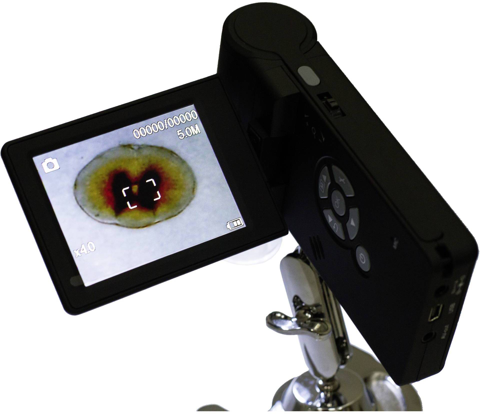 Digitale camera met uitklapbaar scherm toont een close-up van een object met een ronde, meerkleurige structuur.