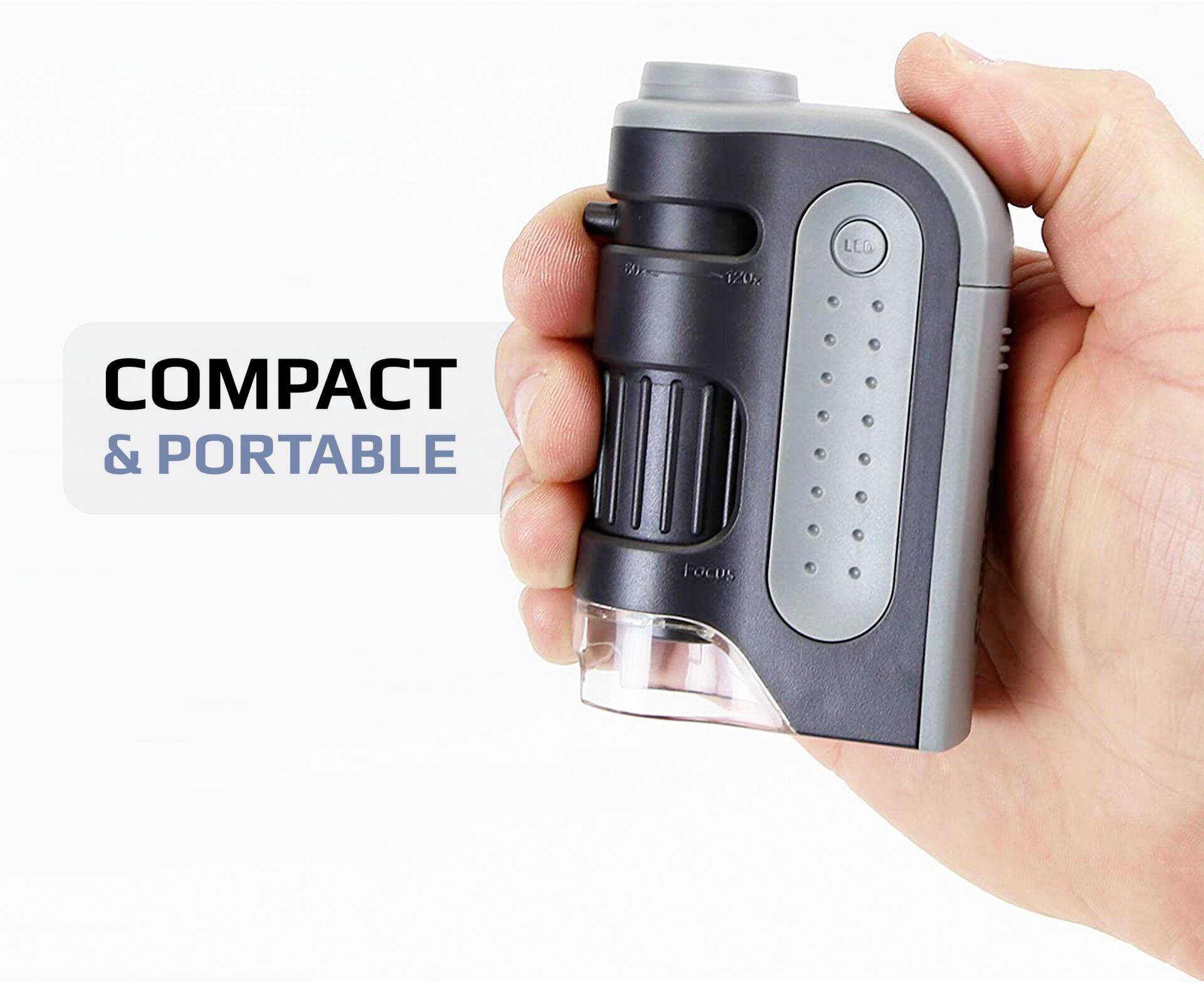 Een hand houdt een compact, draagbaar apparaat vast. Op de afbeelding staat 'COMPACT & DRAAGBAAR'. Het apparaat heeft een grijze en zwarte oppervlakte.